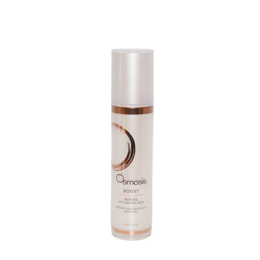 Osmosis Boost Hydration Spray in a clear cylindrical bottle with a metallic silver cap and a white label featuring a rose gold circular accent, set against a plain white background.
